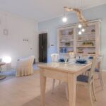Bright dining room featuring rustic furniture and elegant decor elements.